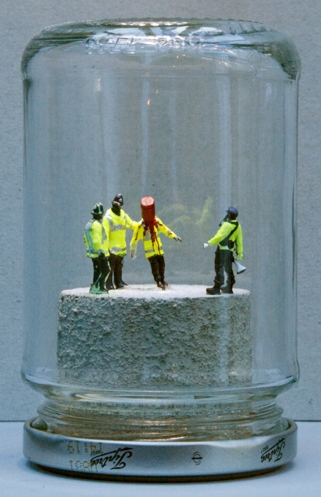 RED EXTINGUISHER on Policeman's Head